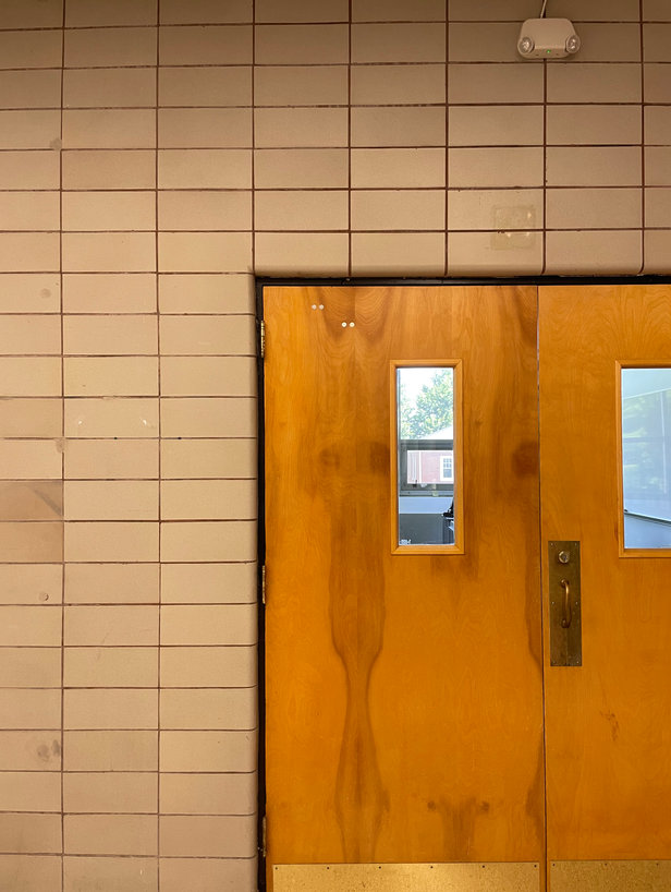 Wood doors in a tiled wall