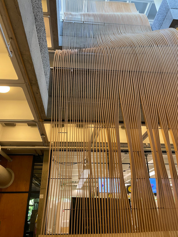 Suspended wooden slat installation