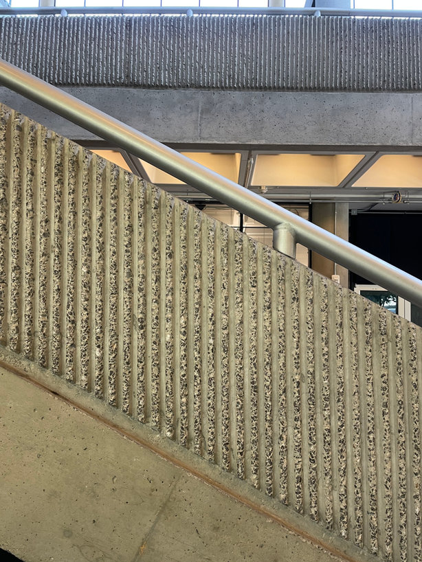 Ribbed concrete wall and steel railing