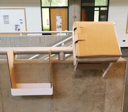 Cardboard prototype hanging on a railing