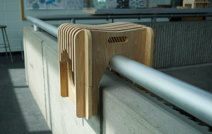 Critique Stül hung on the atrium railing