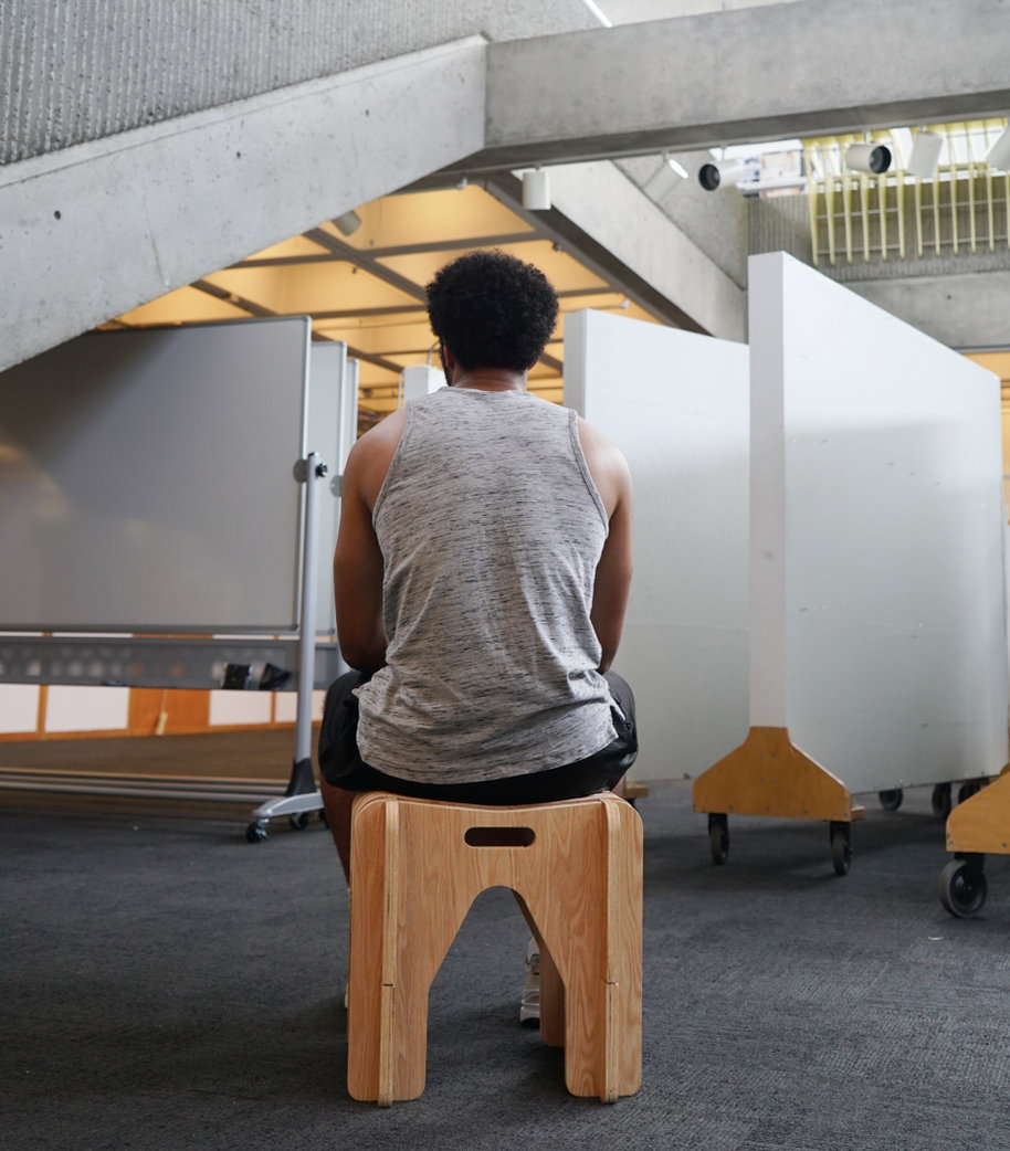 Student seated during a critique