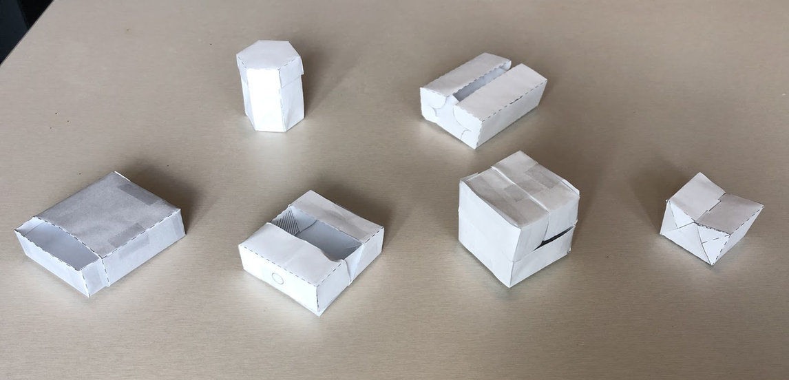 Row of folded paper box models